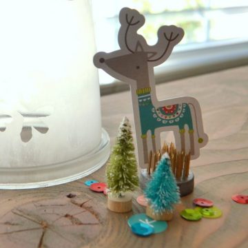 Using a small cloche filled with Fancy Pants scrapbook supplies on seelindsay.com