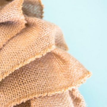 Create this DIY Burlap Wreath using 3 items. Ruffle the burlap ribbon to give your wreath dimension. #burlap #craftlightning
