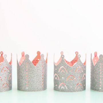 Create the perfect princess party crowns by using glitter cardstock and coordinating patterned paper. Get all the details on the blog. #princessparty #princesspartyideas #diypapercrown #cricut #cricutmade
